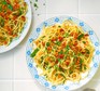 Two servings of aglio e olio with sundried tomato breadcrumbs