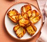 Pieces of air fryer halloumi on a plate