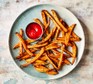 Air fryer sweet potato fries served with tomato sauce