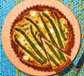 Asparagus, feta & dill quiche with the first slice cut out