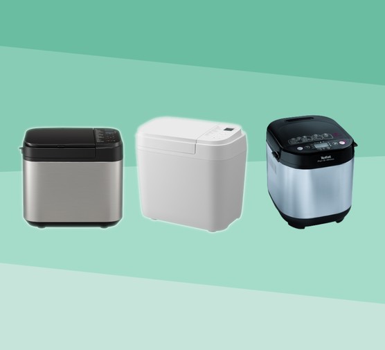 Three breadmakers against a tonal green background