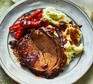 Bourbon & honey-glazed brisket with soured cream & chive mash served on a plate