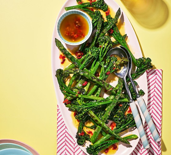 A sharing plate of charred asparagus & broccoli with blistered chilli dressing