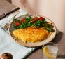 Cheese omelette on a plate with a green salad
