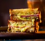 Two slices of air-fryer cheese & ham toastie stacked together