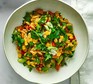 Chorizo, orzo & sweetcorn summer stew served in a bowl