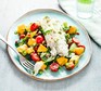 A plate of cod with cucumber, avocado & mango salsa salad