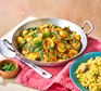 Courgette curry in a pan with lemon rice on the side
