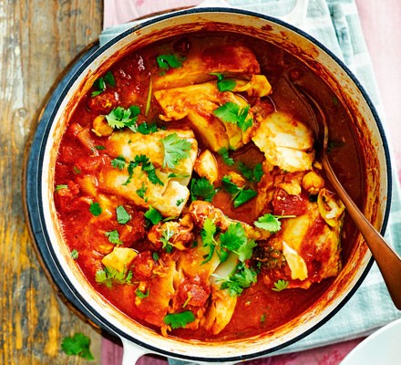Cod in a curry sauce topped with coriander