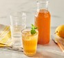 Ginger beer served in a bottle and a glass