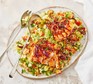 A serving of harissa fish with bulgur salad