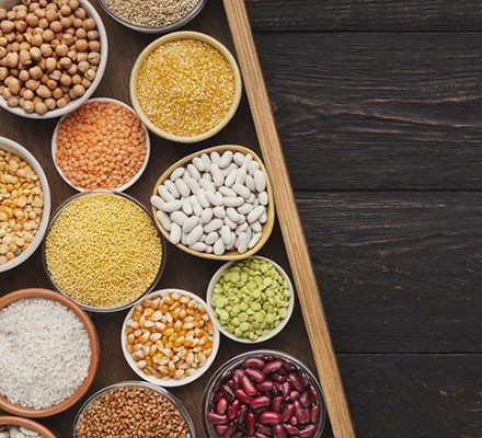 20 high-protein vegetarian foods Cereals and legumes assortment on wooden background
