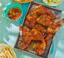 Honey harissa lamb chops on a baking tray