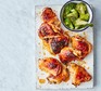 Honey & soy chicken thighs with sesame broccoli served on a board
