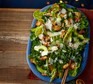 Kale caesar salad served on a blue plate