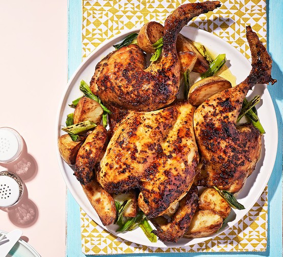 A plate serving a maple & mustard glazed spatchcock chicken