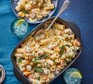 A baking dish with one-pan pumpkin, sage & meatball pasta