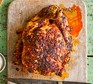 Piri-piri chicken served on a wooden board