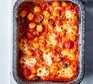 Puttanesca baked gnocchi served in a casserole dish