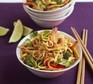 Superhealthy vegetarian Singapore noodles in a bowl with chopsticks