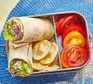 Spicy tuna wrap in a lunchbox
