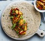 Wraps filled with spicy chicken, avocado and peppers
