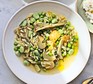 Spring vegetable orzo with broad beans, peas, artichokes & ricotta served in a bowl