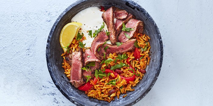 High protein bowl recipes Steak burrito bowl with rice, peppers and lemon