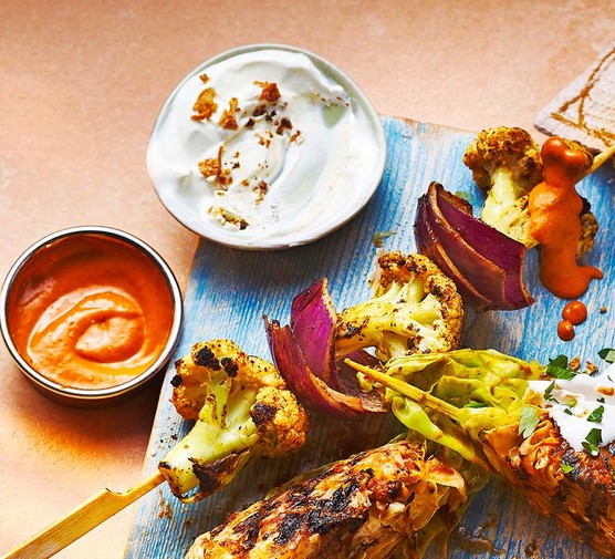 Two tikka cauliflower skewers with makhani sauce