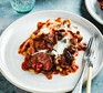 Plate of slow cooker vegetable lasagne with cutlery