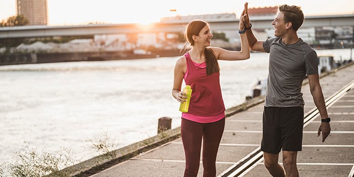 Friends walking in sports gear