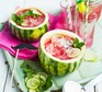 Two half watermelons filled with watermelon lemonade