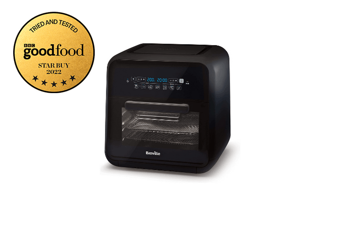 A black air fryer against a white background with a star buy badge next to it